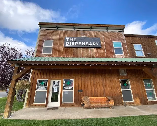 The wood panelled storefront of The Dispensary in Gunnison, CO